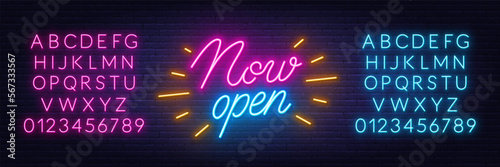 Now Open neon sign on brick wall background.