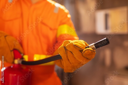 worker with fire extinguisher