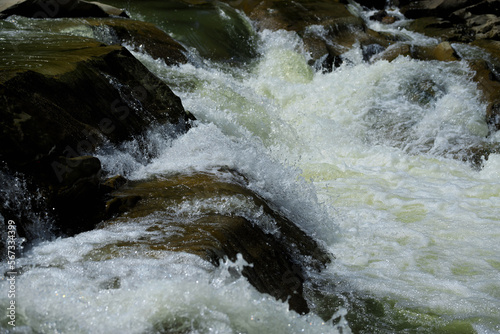 Stormy flow of a mountain river, stones