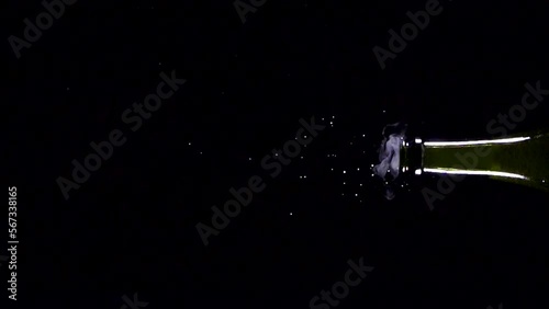 Super slow motion shot of champagne explosion, opening champagne bottle closeup. Filmed on high speed cinema camera, 4k1000fps