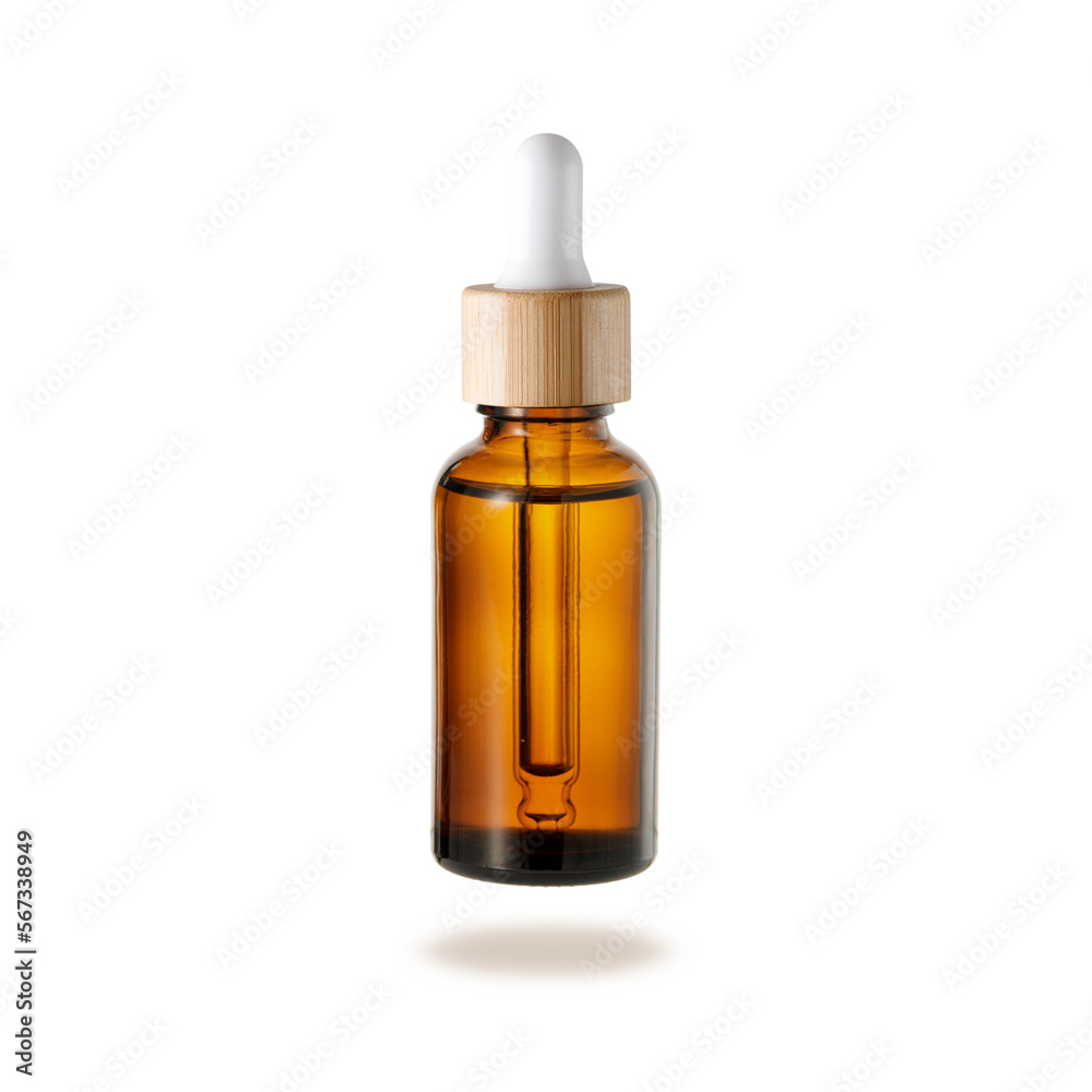 Glass dropper bottle with cap of bamboo wood for face serum or essential oil or pharmaceutical tincture.