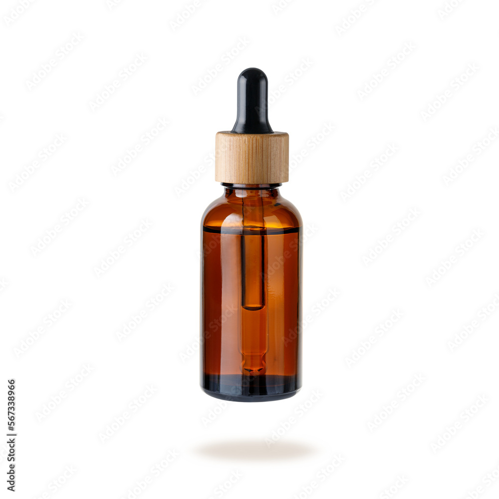 Glass dropper bottle with cap of bamboo wood for face serum or essential oil or pharmaceutical tincture.