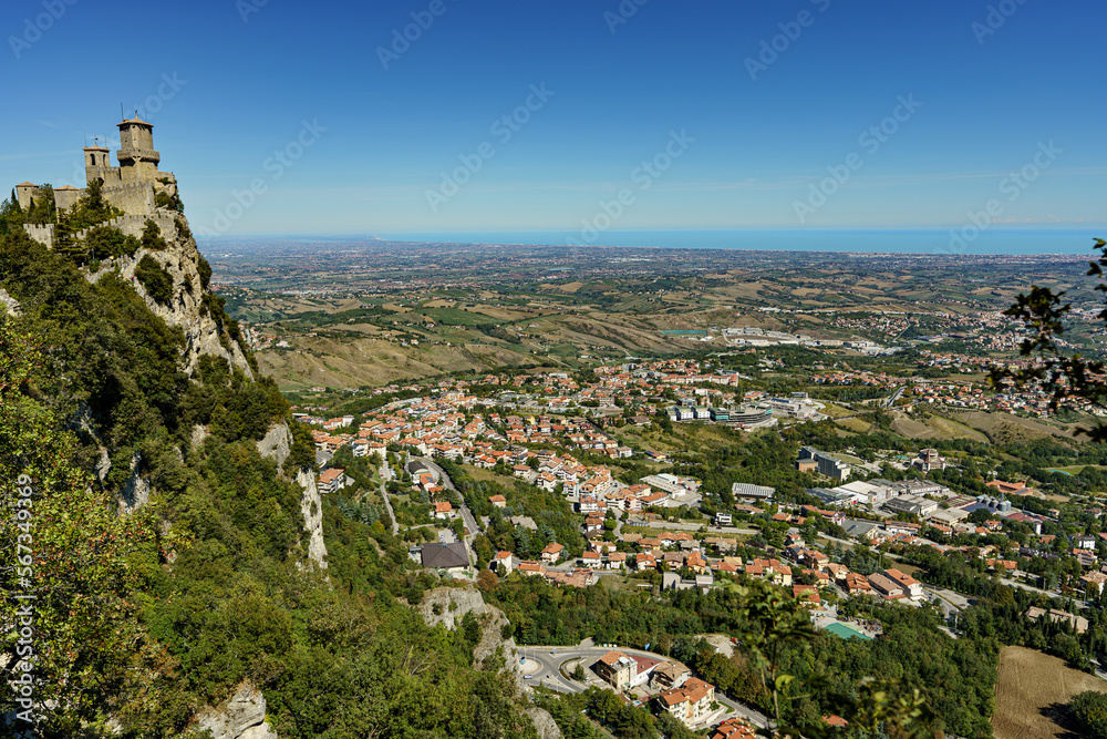 View of the old castle on a high mountain with the modern city below.