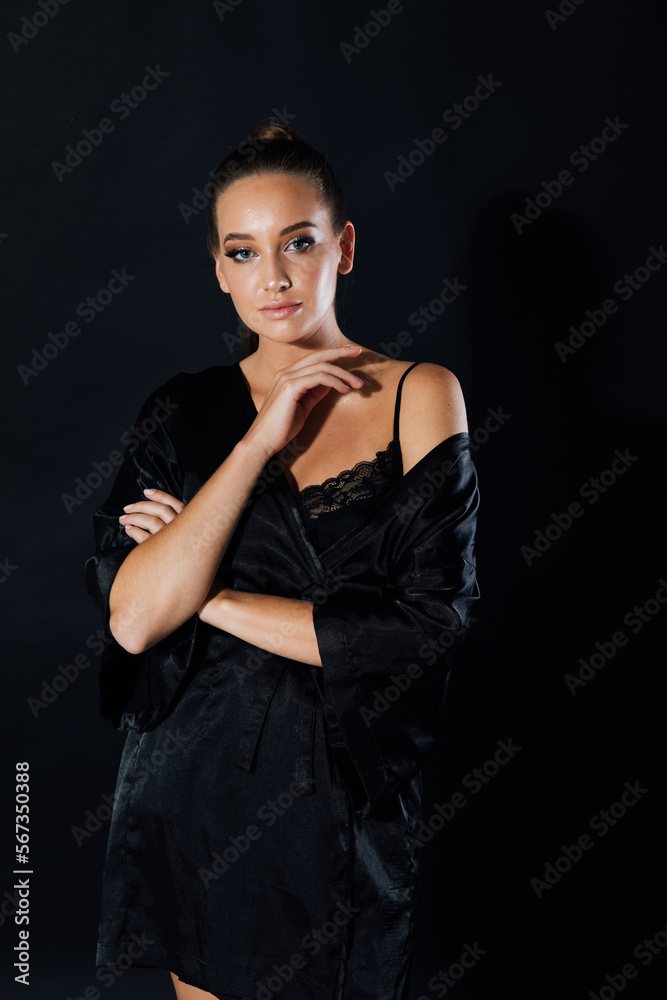 beautiful woman standing in black underwear at night