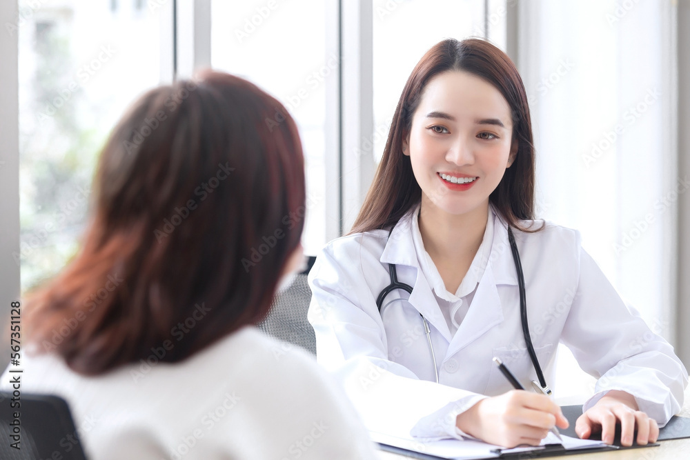 Asian professional doctor female who wears medical coat talks with woman patient to her patient elderly in examination room,healthcare concept in office of hospital. Asian professional doctor female who wears medical coat talks with woman patient to her patient elderly in examination room,healthcare concept in office of hospital.
