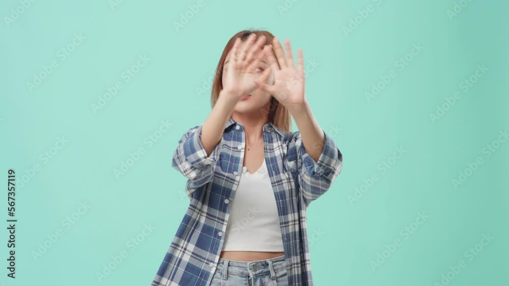 Young Asian student girl with backpack on green background studio. Young Asian student girl with backpack on green background studio.