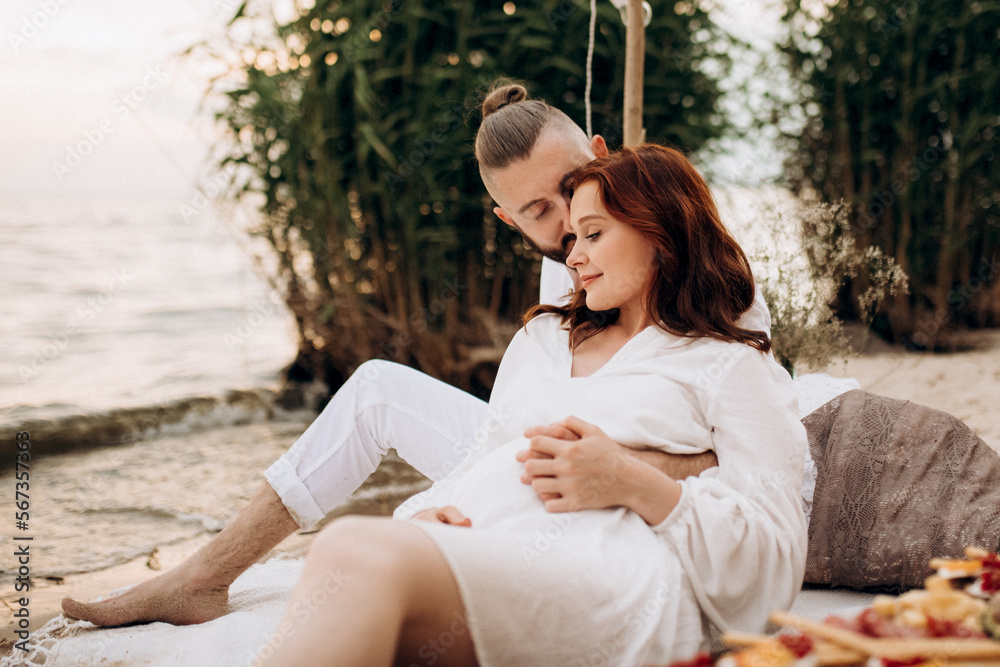 pregnant girl and boyfriend on a picnic pregnant girl and boyfriend on a picnic
