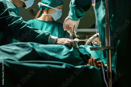 emergency doctor team working using tools to save people. medical staff team wearing uniform helping patient in surgery with equipment. specialist surgical group performing medical tools procedure