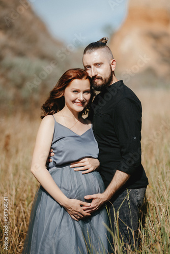 pregnant girl and boyfriend on high hills