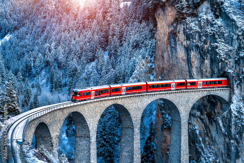 Canvas Print Aerial view of Train passing through famous mountain in Filisur, Switzerland
