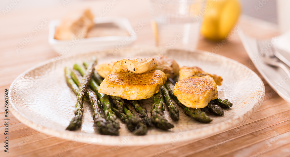 dietary meal rich in protein. Stir fried chicken breast and green asparagus dietary meal rich in protein. Stir fried chicken breast and green asparagus