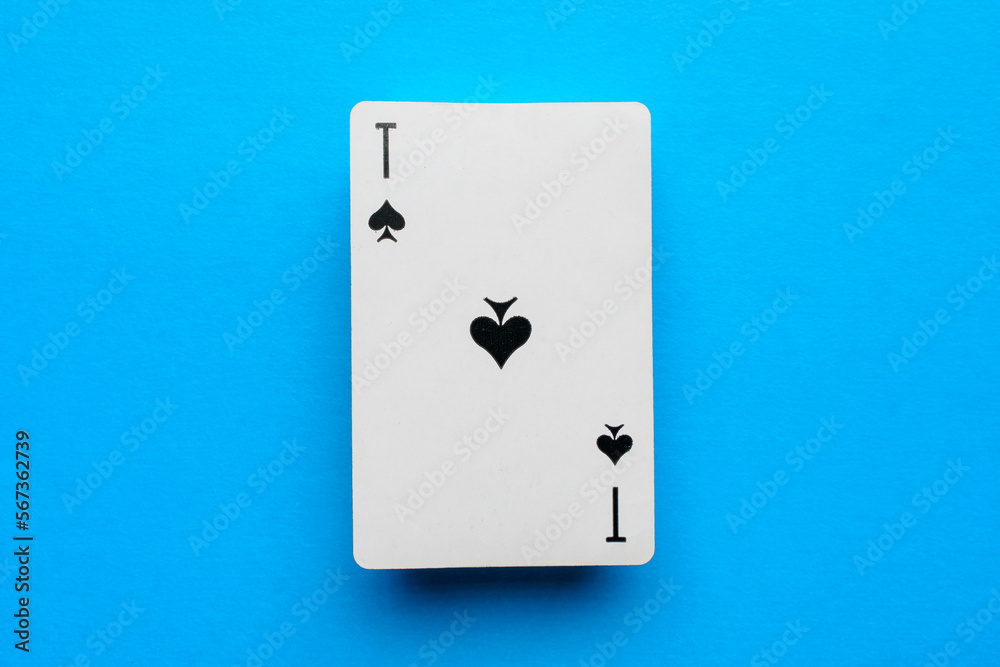 Playing card ace of spades on a blue background