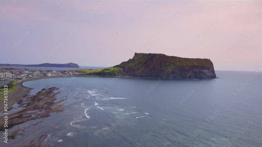 Aerial video of Seongsan Ilchulbong with sunrise in the morning time, Jeju island South Korea. Aerial video of Seongsan Ilchulbong with sunrise in the morning time, Jeju island South Korea.