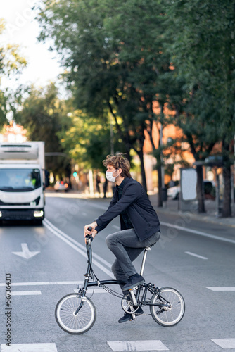 Man Riding Bike in Street