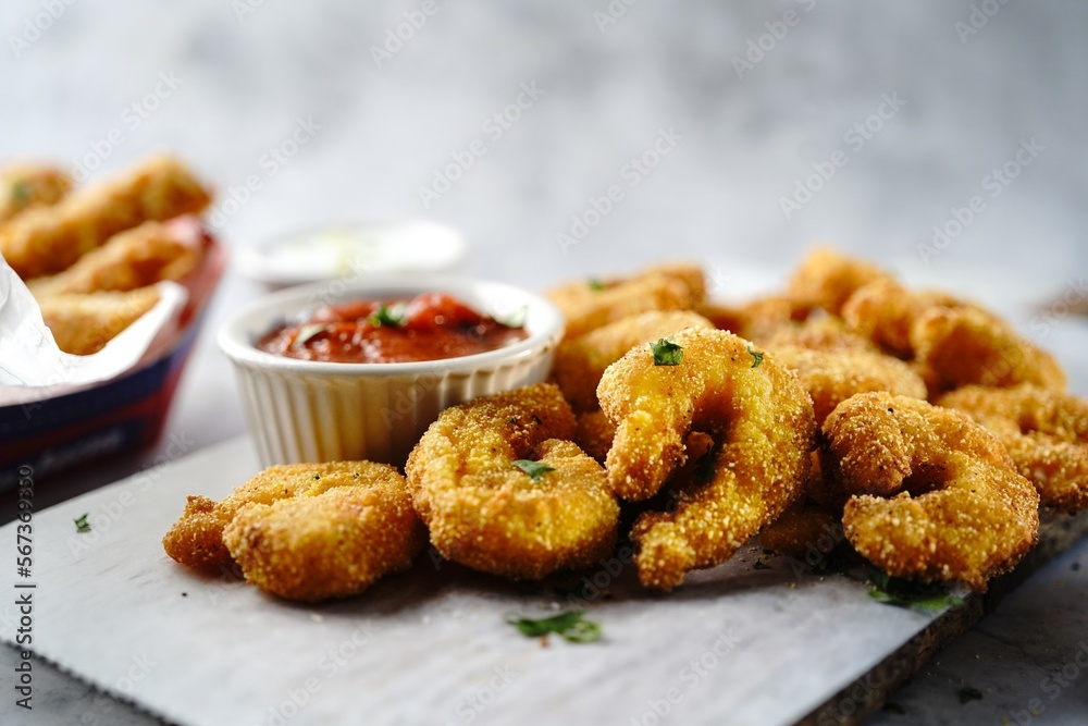 Homemade Popcorn shrimps breaded with cornmeal | Game day appetizer, selective focus Homemade Popcorn shrimps breaded with cornmeal | Game day appetizer, selective focus