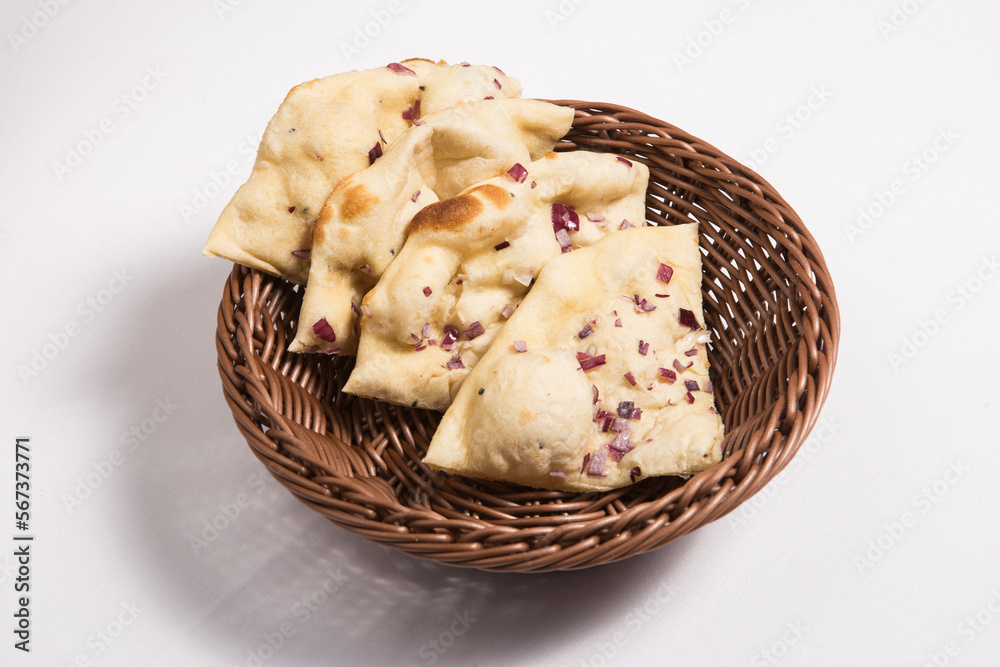 Stack of indian naan bread in small basket Stack of indian naan bread in small basket