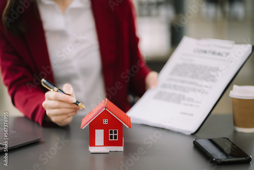 Considering buying a home, investing in real estate. Broker signs a sales agreement. agent, lease agreement, successful deal.