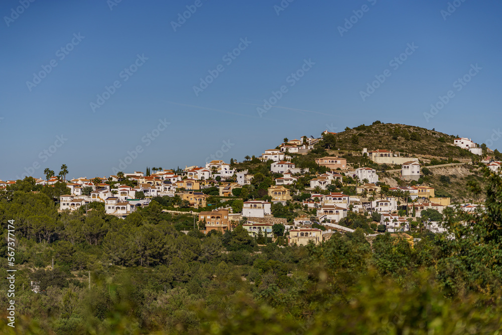 Fototapeta premium Beautiful panorama overlooking a distant town with the sea and forest in the background
