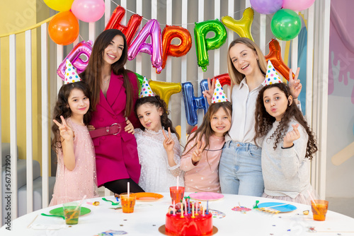 A group of children celebrate a children's birthday, have fun and laugh.