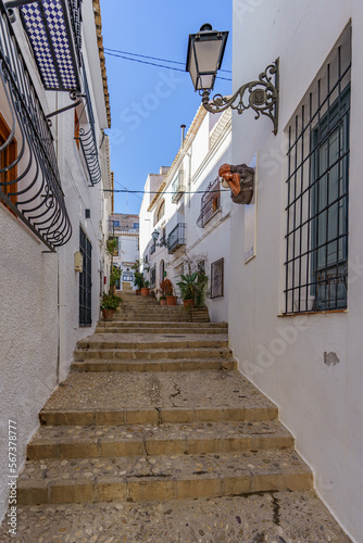 An old atmospheric city with narrow and cramped quiet streets and stairs photo