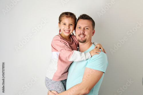 Happy young father dancing with his daughter