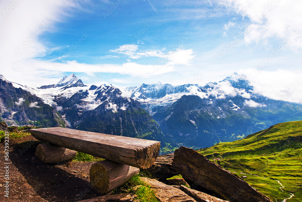 The picturesque landscape with a bench and a view of the mountains in the Swiss Alps, Europe