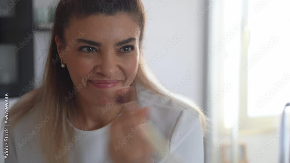 Brazilian Smiling Woman Apply Makeup. Put On Color Correction Cream With Cosmetic Brush Female Morning Routine In Bathroom. Soft Focus Brazilian Smiling Woman Apply Makeup. Put On Color Correction Cream With Cosmetic Brush Female Morning Routine In Bathroom. Soft Focus