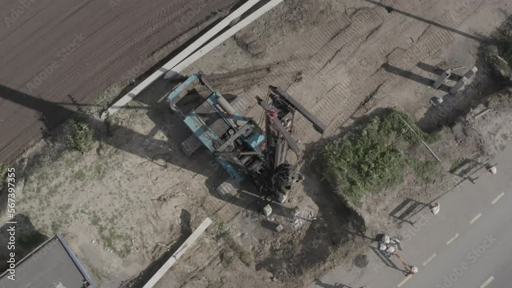 Pile driving machine driving piles into ground site. Modern hydraulic lifting mechanisms. Ukraine. Pile driving machine driving piles into ground site. Modern hydraulic lifting mechanisms. Ukraine.