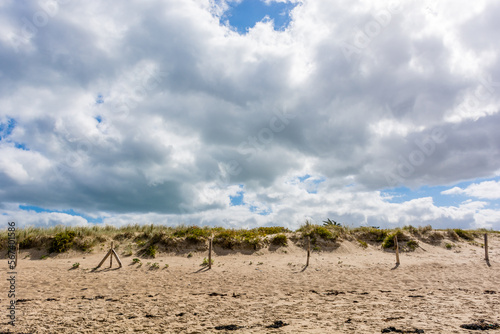 Scenic view of beach in Brittany France against dramatic summer sky © Horia Merla