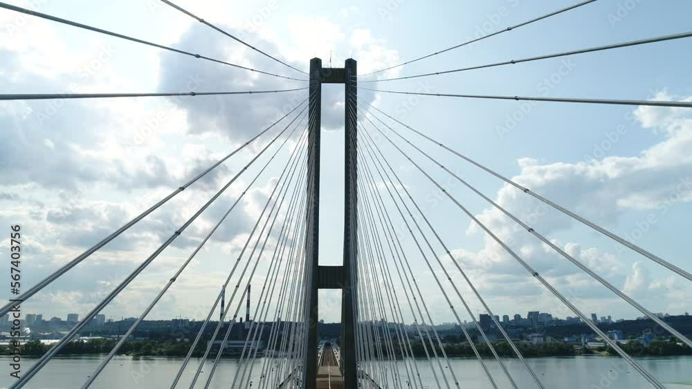 Aerial survey of the south bridge in Kyiv through the Dnieper. Ukraine. Summer. Warm morning. Aerial survey of the south bridge in Kyiv through the Dnieper. Ukraine. Summer. Warm morning.