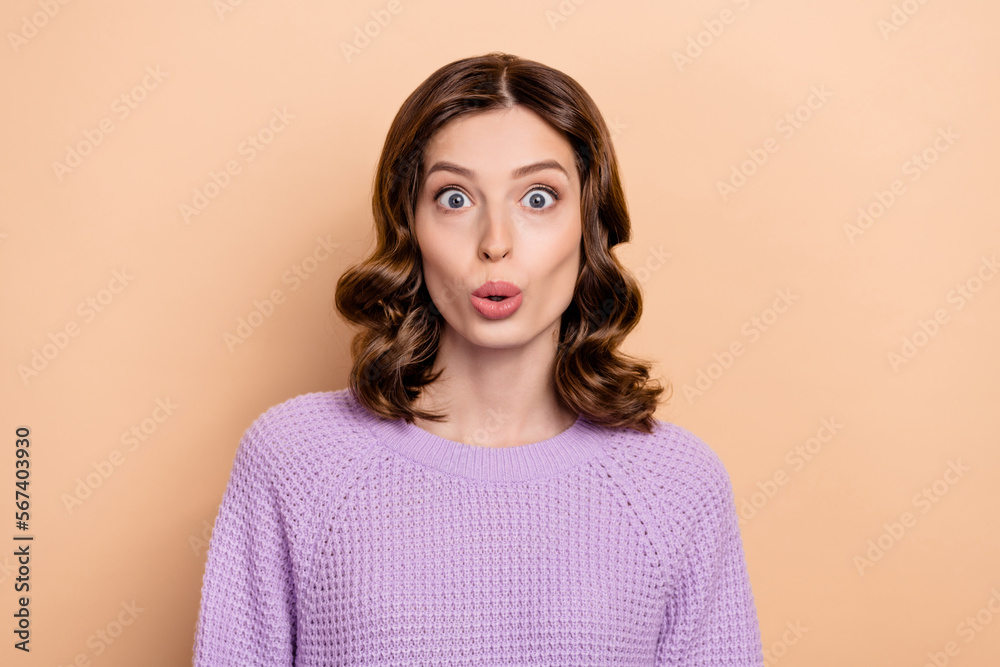 Portrait of astonished ecstatic girl with wavy hairstyle dressed violet pullover staring at discount isolated on pastel color background Portrait of astonished ecstatic girl with wavy hairstyle dressed violet pullover staring at discount isolated on pastel color background