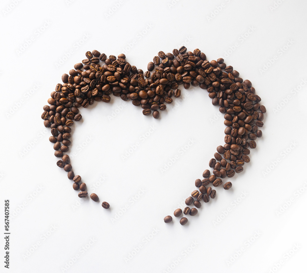 Coffee lover. Coffee beans arranged in a beautiful heart shape on white background. Festive card for Valentines Day. top view. flat lay. 3D illustration Coffee lover. Coffee beans arranged in a beautiful heart shape on white background. Festive card for Valentines Day. top view. flat lay. 3D illustration