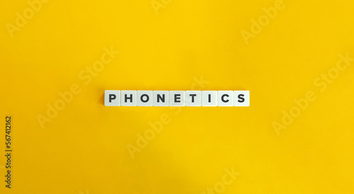 Phonetics Word on Letter Tiles on Yellow Background. Minimal Aesthetics.