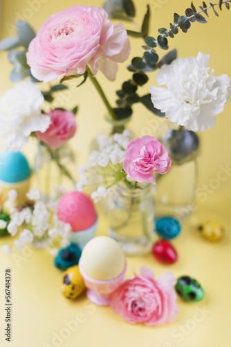 Easter eggs  flowers on yellow background
