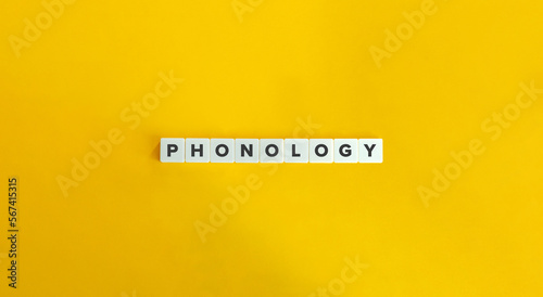Phonology (the study of speech sounds) Word on Letter Tiles on Yellow Background. Minimal Aesthetics.