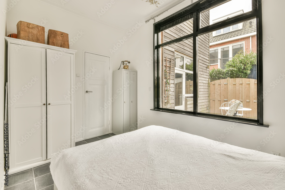 Bedroom interior with bed and wardrobe Stock Photo | Adobe Stock