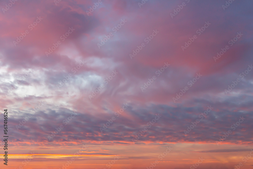Beautiful evening sunset sky with pink clouds