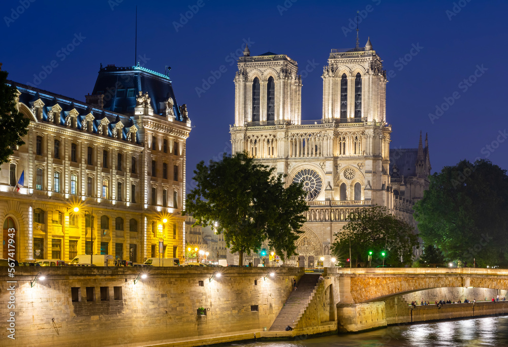 Notre-Dame de Paris cathedral on Cite island at night, France