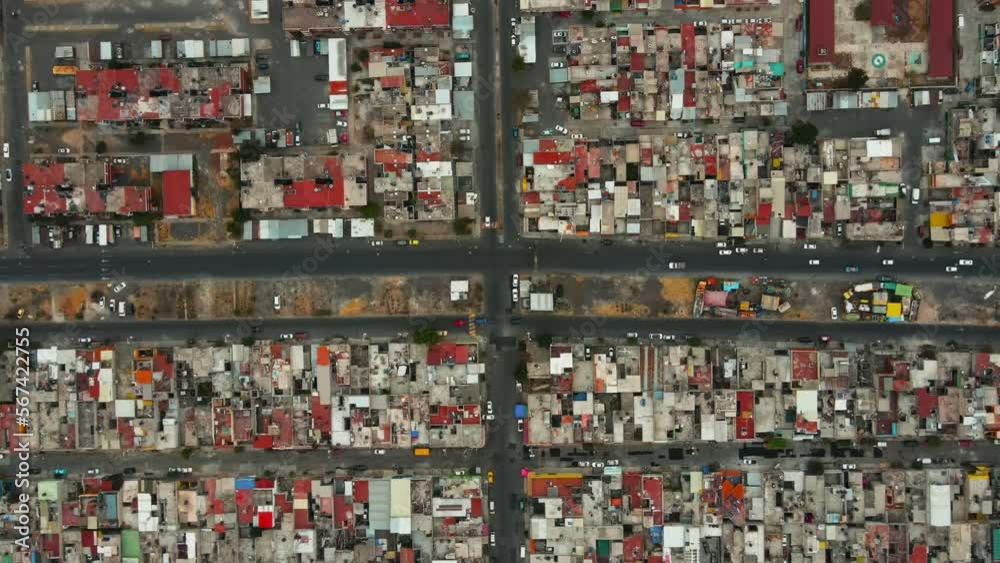 Zenith view over traffic junction in city urban district. Overhead view on intersection in the suburbs of Mexico City. Zenith view over traffic junction in city urban district. Overhead view on intersection in the suburbs of Mexico City.