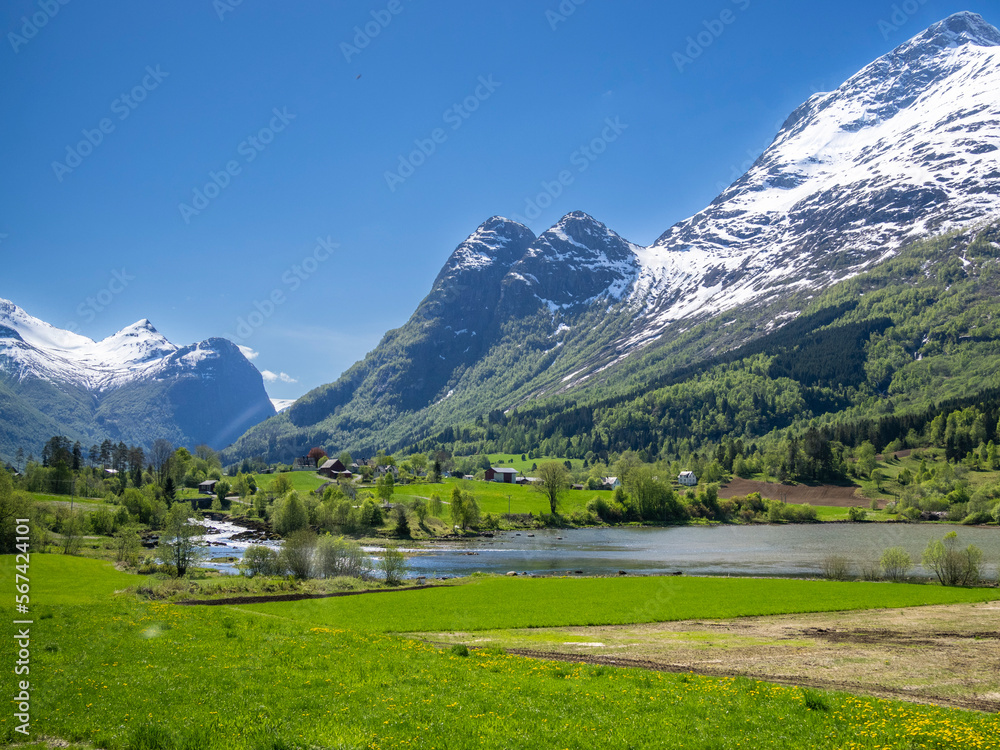A view of houses along the shore of Lake Oldevatnet, within the Oldedalen River Valley, Vestland, Norway, Scandinavia, Europe A view of houses along the shore of Lake Oldevatnet, within the Oldedalen River Valley, Vestland, Norway, Scandinavia, Europe