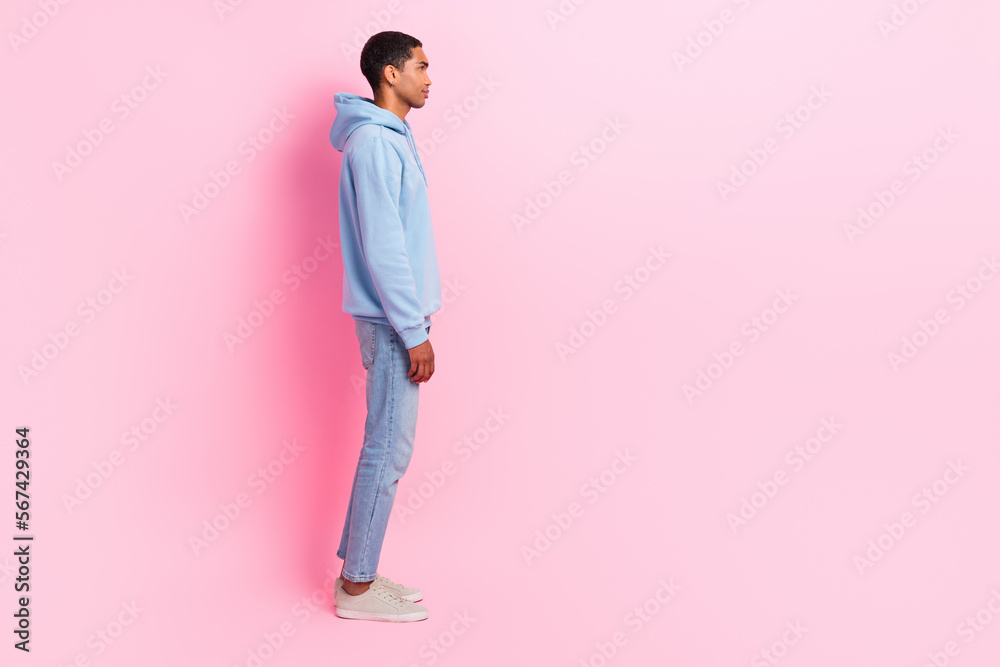 Profile side photo of attractive successful confident man wear blue trendy outfit look empty space isolated on pink color background Profile side photo of attractive successful confident man wear blue trendy outfit look empty space isolated on pink color background