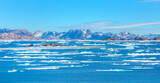Melting icebergs by the amazing coast of Greenland, on a beautiful summer day - Kulusuk, Greenland