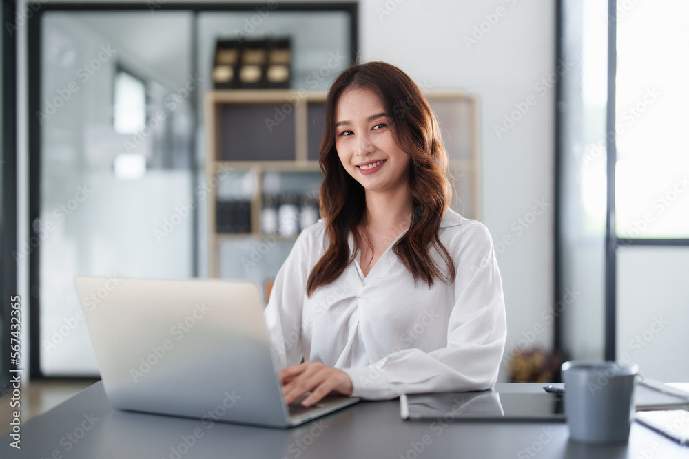 Beautiful Business woman working at home office and analyze financial report document. Accounting and Finance concept Beautiful Business woman working at home office and analyze financial report document. Accounting and Finance concept