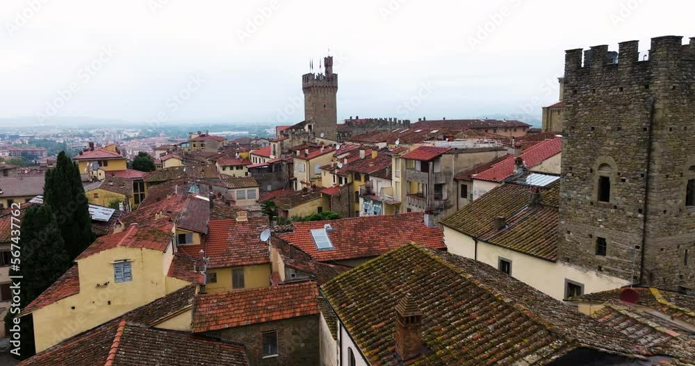 Flying On Medieval Town Through Palazzo dei Priori Clock Tower In Arezzo, Tuscany Italy. Aerial Drone Shot Flying On Medieval Town Through Palazzo dei Priori Clock Tower In Arezzo, Tuscany Italy. Aerial Drone Shot
