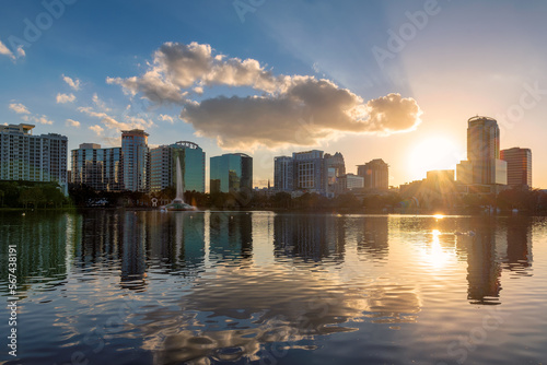 Orlando city at sunset in Lake Eola Park with fountain and cityscape  Florida  USA
