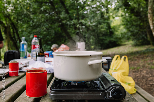 macaroni boiling in the casserole in a gas camping site photo