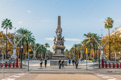 Barcelona, Spain - November 26, 2021: Monument to Francesc de Paula Rius i Taulet by Pere Falques and Manuel Fuxa in Barcelona. View from Ciutadella Park to Passeig de Lluis Companys on an autumn day photo