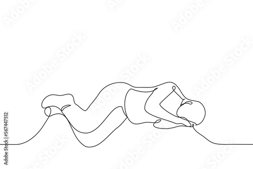 man lying on the floor or ground using his own hands instead of a pillow - one line drawing vector. concept homeless, sleeping on the street
