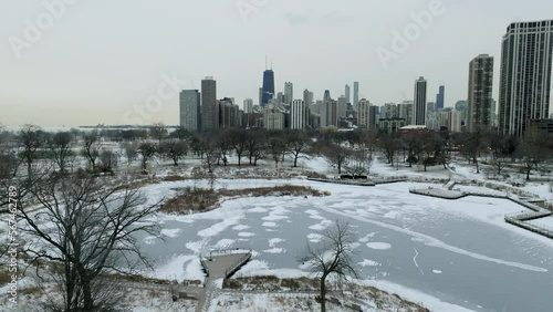 Aerial view rising over the Lincoln Park Zoo towards the downtown of Chicago, cloudy, winter day in Illinois, USA photo