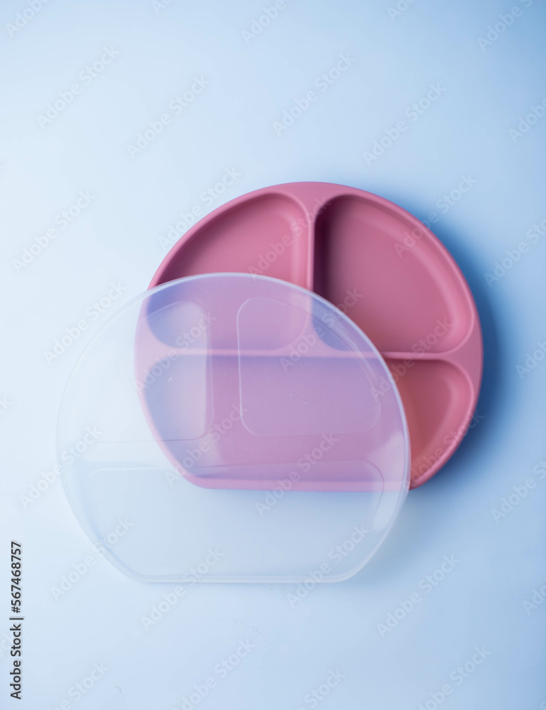 Baby silicone plate isolated on background. Baby feeding and nutrition concept. Top view, flat lay. Baby silicone plate isolated on background. Baby feeding and nutrition concept. Top view, flat lay.